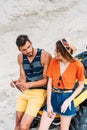 high angle view of confused lost young couple with ATV using digital tablet