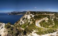 High angle view of The Corniche des Cretes surrounded by greenery and the sea in France