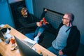 high angle view of couple of hackers clinking cans of beer