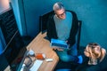 high angle view of couple of hackers working on malware together