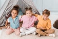 high angle view of cute little kids sitting together and smiling Royalty Free Stock Photo