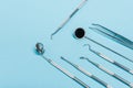 High angle view of dental tools set on blue background. Royalty Free Stock Photo