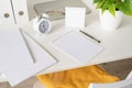 High angle view of desk arrangement with two blank calendars for mock up, magazines and stationery Royalty Free Stock Photo