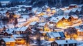 High angle view of exterior residential houses located on snowy streets of modern city with glowing lights in winter time.