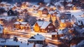 High angle view of exterior residential houses located on snowy streets of modern city with glowing lights in winter time.