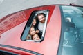 high angle view of family looking out of sunroof