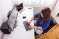 Female programmer coding while working in home office Royalty Free Stock Photo