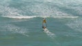 High angle view of a female windsurfer sails at diamond head Royalty Free Stock Photo
