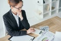 high angle view of financier working at table in office