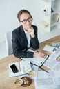 high angle view of financier working at table in office and looking