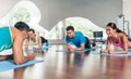 High-angle view of a fitness instructor during group calisthenics class