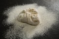 High angle view of flour on kneaded dough