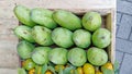 High Angle View Fresh green mangoes in wooden crates for sale in market Royalty Free Stock Photo