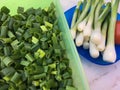 High angle view of fresh sliced spring onions in a green plastic box Royalty Free Stock Photo