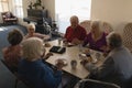 High angle view of group of senior friends having breakfast on dining table Royalty Free Stock Photo