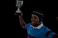 High angle view of happy rugby player holding trophy Royalty Free Stock Photo