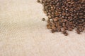 High angle view of a heap of a fresh rosted coffee beans on a burlap sack