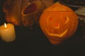 High angle view of illuminated jack o lanterns with candle