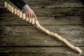 High angle view image of a businessman stopping domino effect Royalty Free Stock Photo