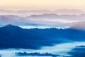 High angle view of layer tropical mountains with white fog Royalty Free Stock Photo