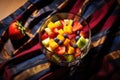 high angle view of leftover fruit salad in a glass bowl