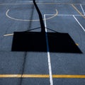High-angle view of lines and shadows on a basketball playground under the sunlight Royalty Free Stock Photo