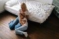 High-angle view of loving caring mother comforting offended afraid little child daughter, showing love and care Royalty Free Stock Photo