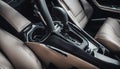 High angle view of luxury sport car front passenger seat and detail high end fabric and stitch texture along with blurred gear