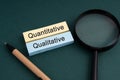 Magnifying glass and text Quantitative and Qualitative Royalty Free Stock Photo