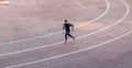 Top view Athlete running on running track. Runner sprinting on red running track in stadium Royalty Free Stock Photo