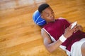 High angle view of male basketball player using mobile phone