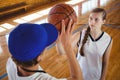 High angle view of male coach training female basketball player Royalty Free Stock Photo