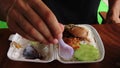 High angle view of a man eating traditional food called Kaw Sach Chrouk