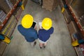 High angle view of managers with hard hat holding tablet and clipboard Royalty Free Stock Photo