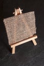 Mini easel on black ground