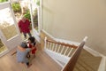 Mixed race senior man arriving home with his grandson and granddaughter Royalty Free Stock Photo