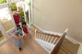 Mixed race senior man arriving home with his grandson and granddaughter Royalty Free Stock Photo