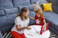 Mother helping daughter with homework Royalty Free Stock Photo