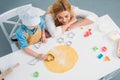 High angle view of mother and son using cooking mold Royalty Free Stock Photo