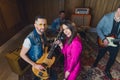 high-angle view of a music band during repetition in the studio, two guitarists, a singer and a drummer Royalty Free Stock Photo