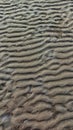 High-angle view of natural rippled sand texture on a beach. Royalty Free Stock Photo