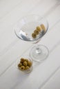 High angle view of olives in container by vodka martini Royalty Free Stock Photo