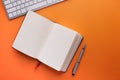 High angle view of open diary pen and keyboard Royalty Free Stock Photo