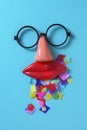 Confetti, fake glasses, nose and mouth