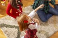 Parents playing with child on Christmas day Royalty Free Stock Photo