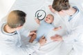 high angle view of pediatricians playing with little baby Royalty Free Stock Photo