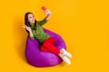 High angle view photo of lady sit bean bag telephone take selfies show v-sign symbol isolated yellow color background