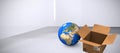 Composite image of high angle view of planet earth and cardboard box Royalty Free Stock Photo