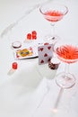 High angle view of playing cards, dice and casino chips near glasses of cocktail on white background Royalty Free Stock Photo