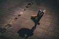 High angle view of professional skateboarder performing trick and standing